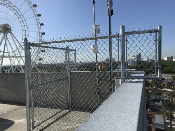 Commercial galvanized chain link security fence installed at ICON Park on International Drive in Orlando, FL.