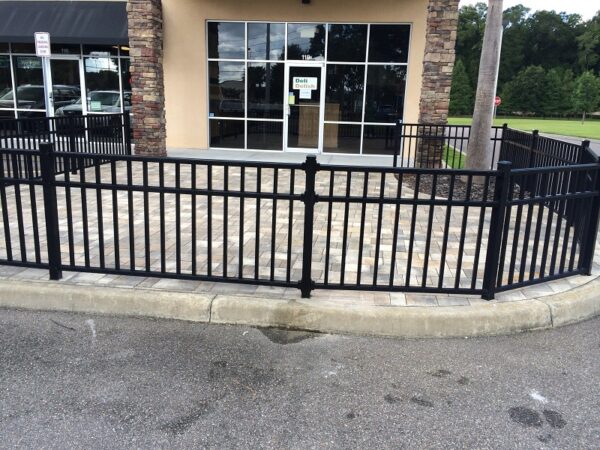 Commercial black ornamental aluminum fence installed around a restaurant patio in Orlando, FL