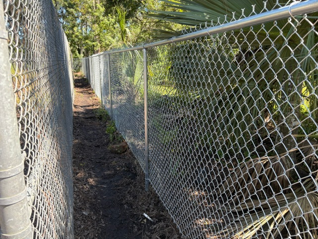 Completed commercial galvanized chain link fence installation in Davenport FL